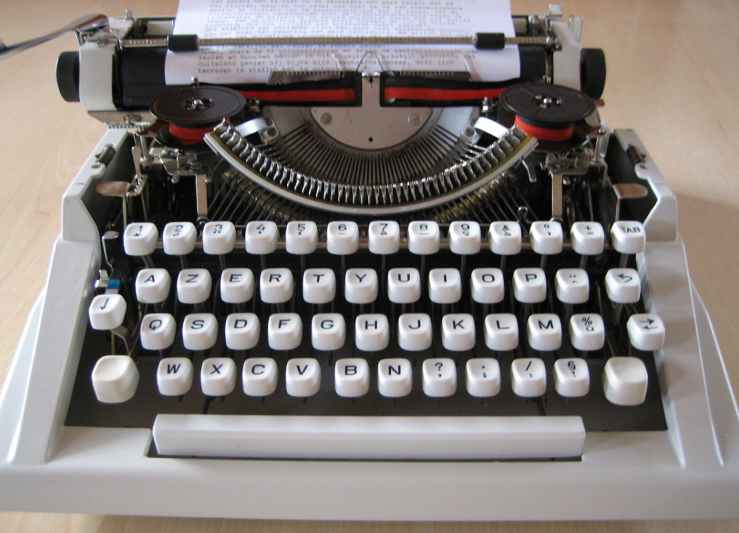 Old Hermes typewriter courtesy of Wikipedia. Forever green, runs on finger and brain power.