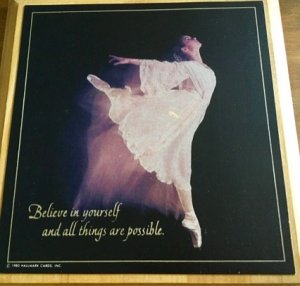Photo of framed ballerina poster with quote, "Believe in yourself and all things are possible."