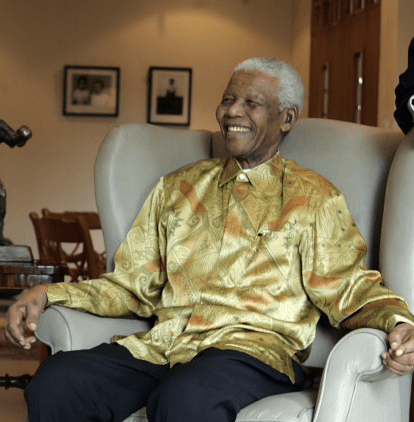 Nelson Mandela wearing one of the colorful 'Madiba' shirts he became known for. Photo courtesy of Wiki