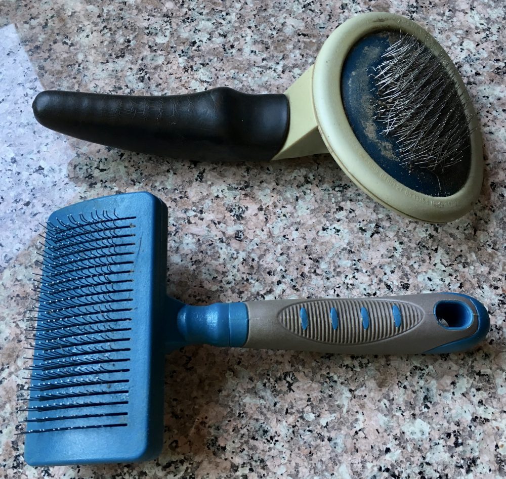 Slicker brushes for cats and dogs.