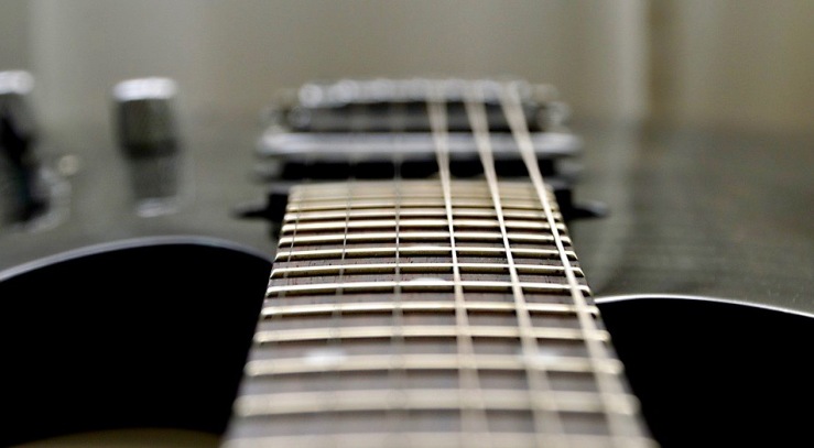 Photo looking down neck of a guitar
