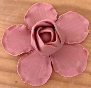 Building the layers of a fondant peony. 