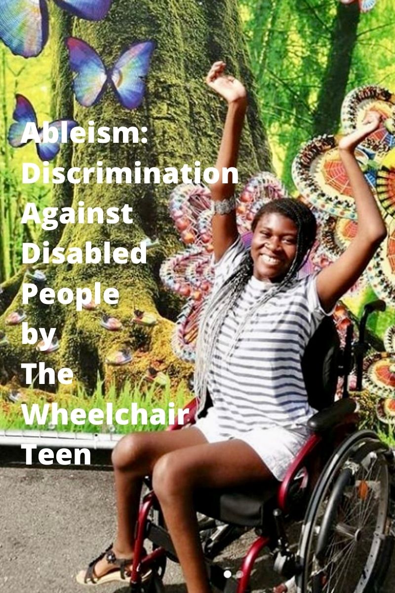 The Disabled Teen having fun in front of a carnival wall.