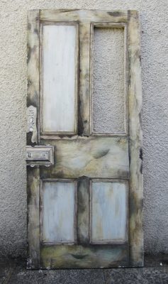 Art of a door frame leaning on a wall by Sara Allwright.