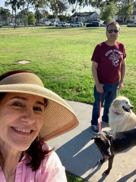 Photo of da-AL with Khashayar, their black pitbull mix, and a golden retriever.
