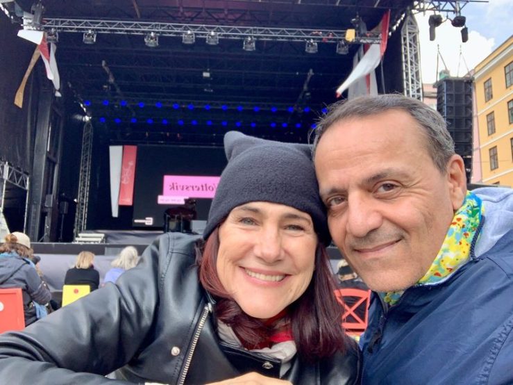 Photo of da-AL and Khashayar in front of an outdoor stage in Bergen, Norway.