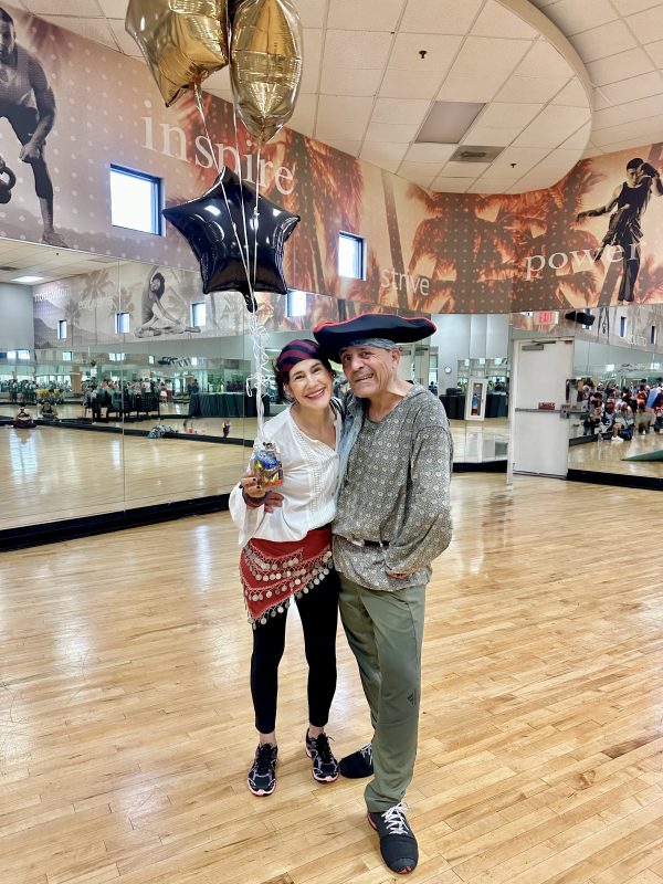 da-AL and Khashayar dressed again as pirates, goofing for the camera at a fitness gym.