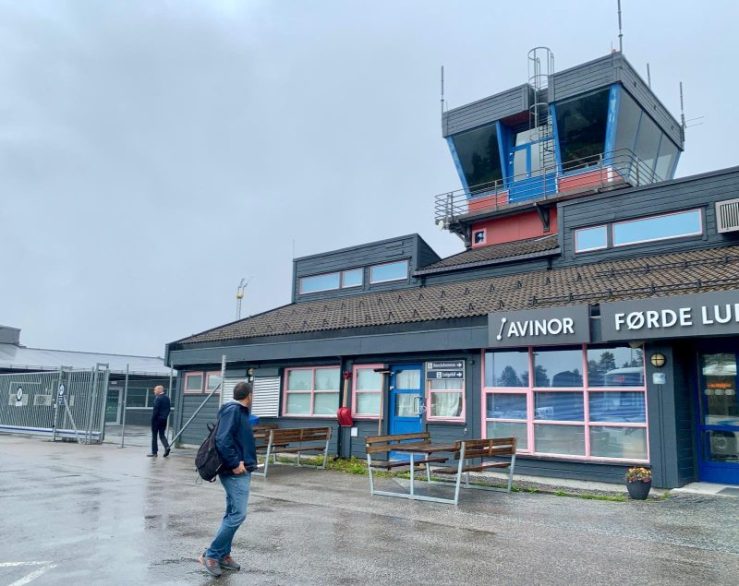 Khashayar walking in the rain into little Førde Airport.
